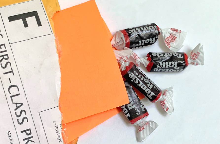 Tootsie Rolls falling out of envelope